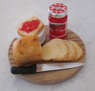 Loaf, Jam, Toast, Knife on a Board